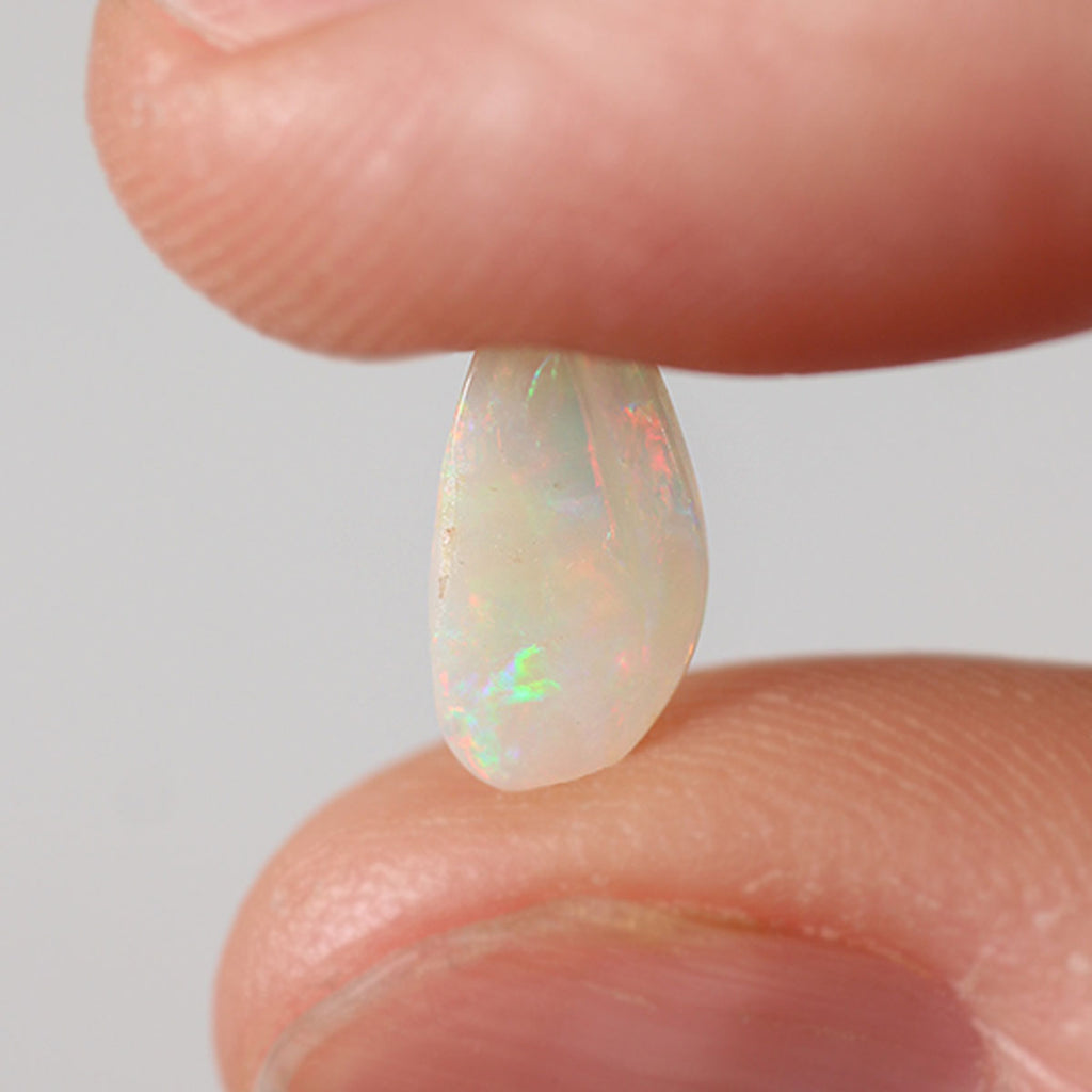 Macro detail of light opal cabochon