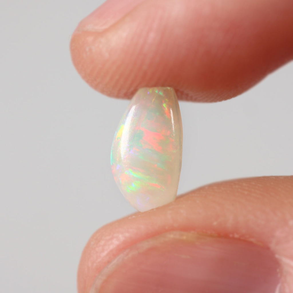 Size reference of 0.76ct light opal cabochon