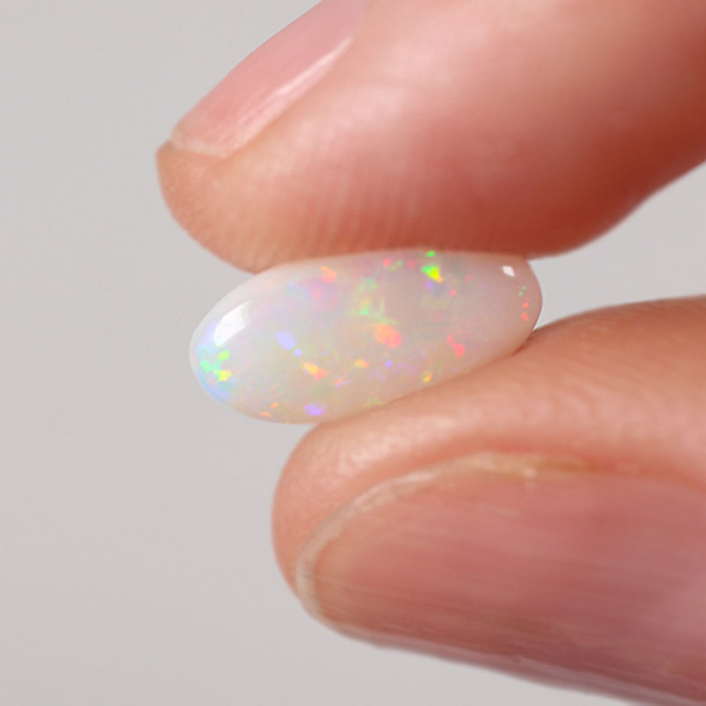 1.16ct Australian light opal cabochon with pink-blue floral