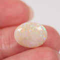 Macro detail of light opal cabochon