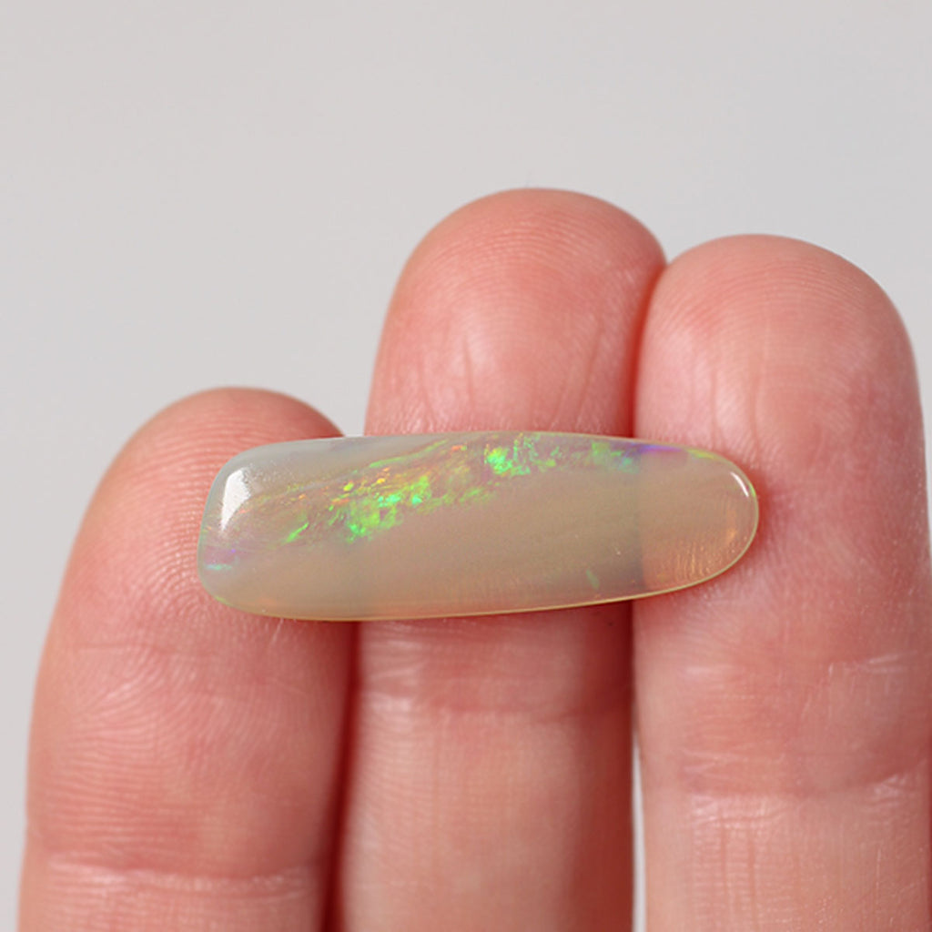 5.8ct dark crystal opal from Lightning Ridge with green-orange foil flash play-of-colour