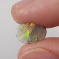 Natural dark opal from Lightning Ridge, 0.9ct with bright orange-green flash