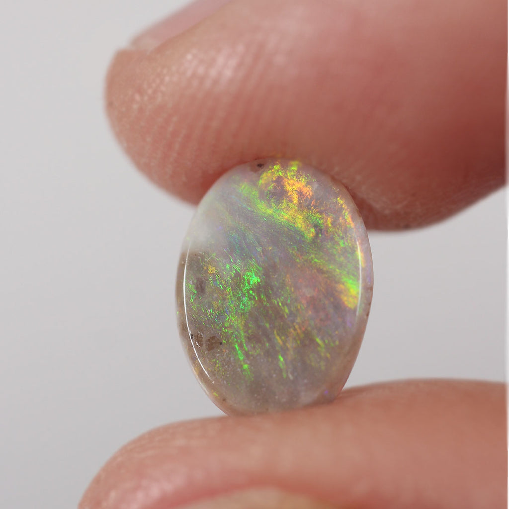 0.9ct Australian dark opal shown for size comparison