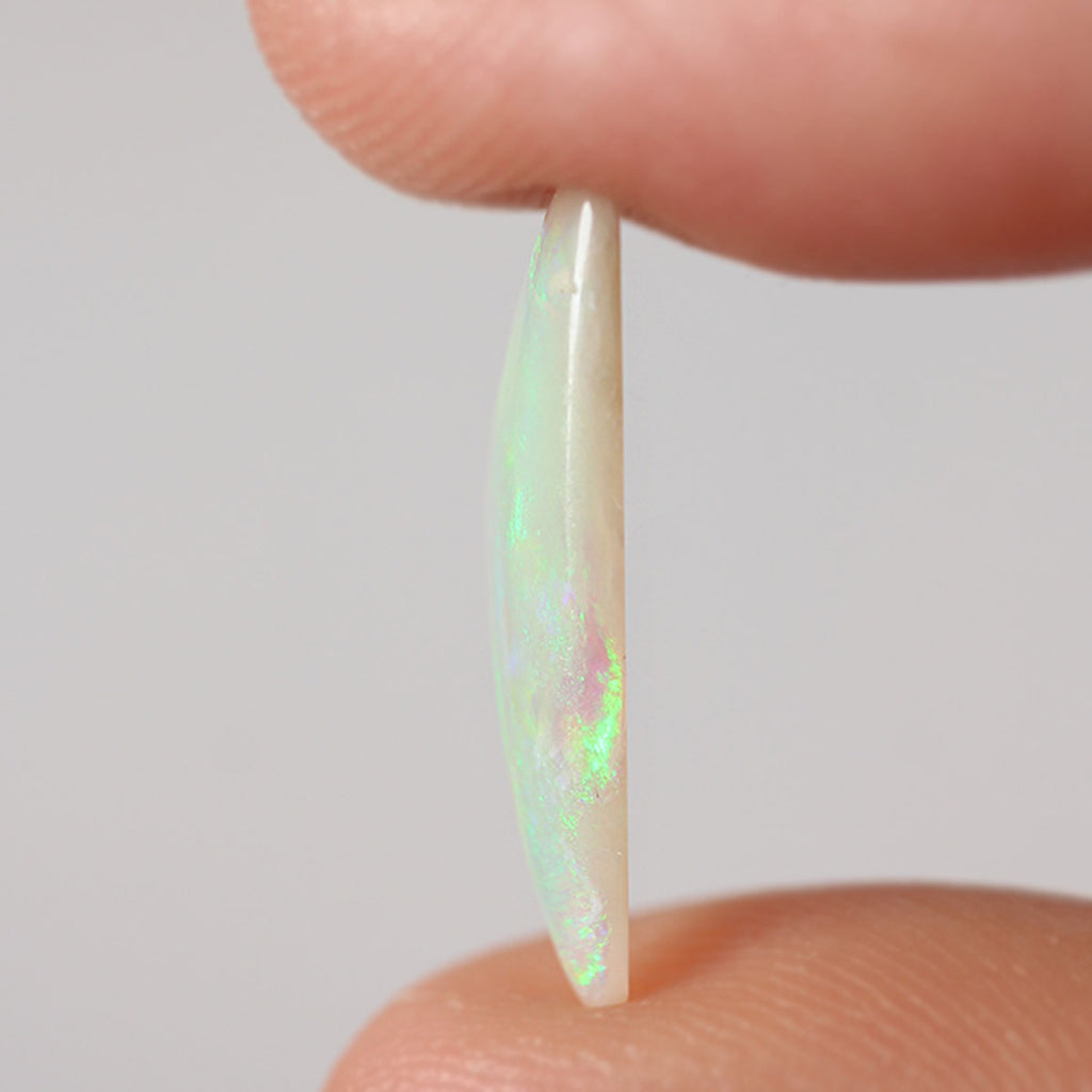 Detail of lively green flash on light opal