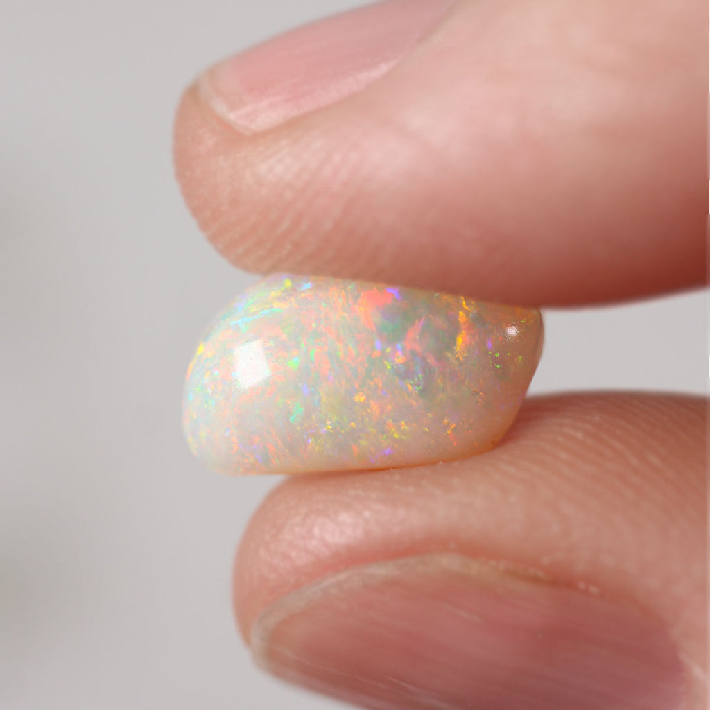 Macro detail of light opal cabochon