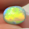 Natural dark opal from Lightning Ridge, 1.77ct with bright orange-green flash