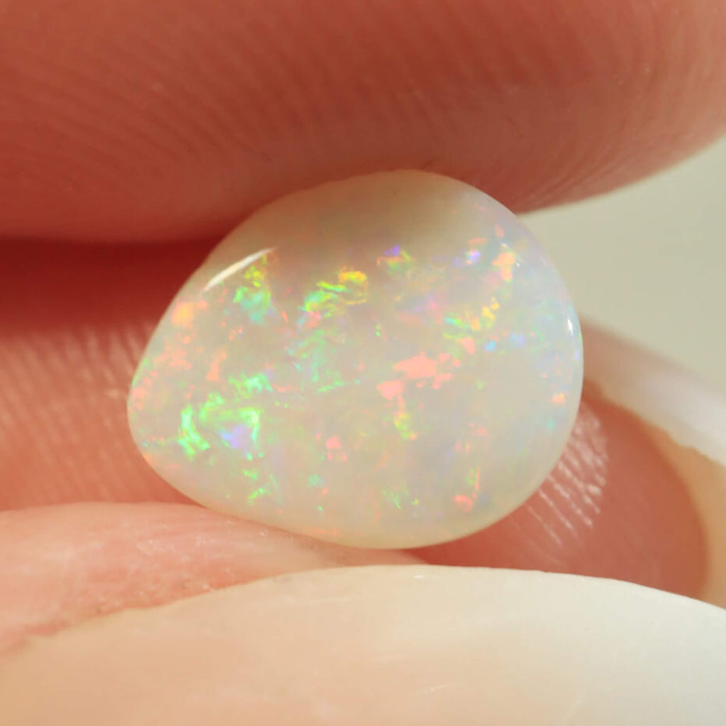 Light opal surface detail showing orange-purple play-of-colour