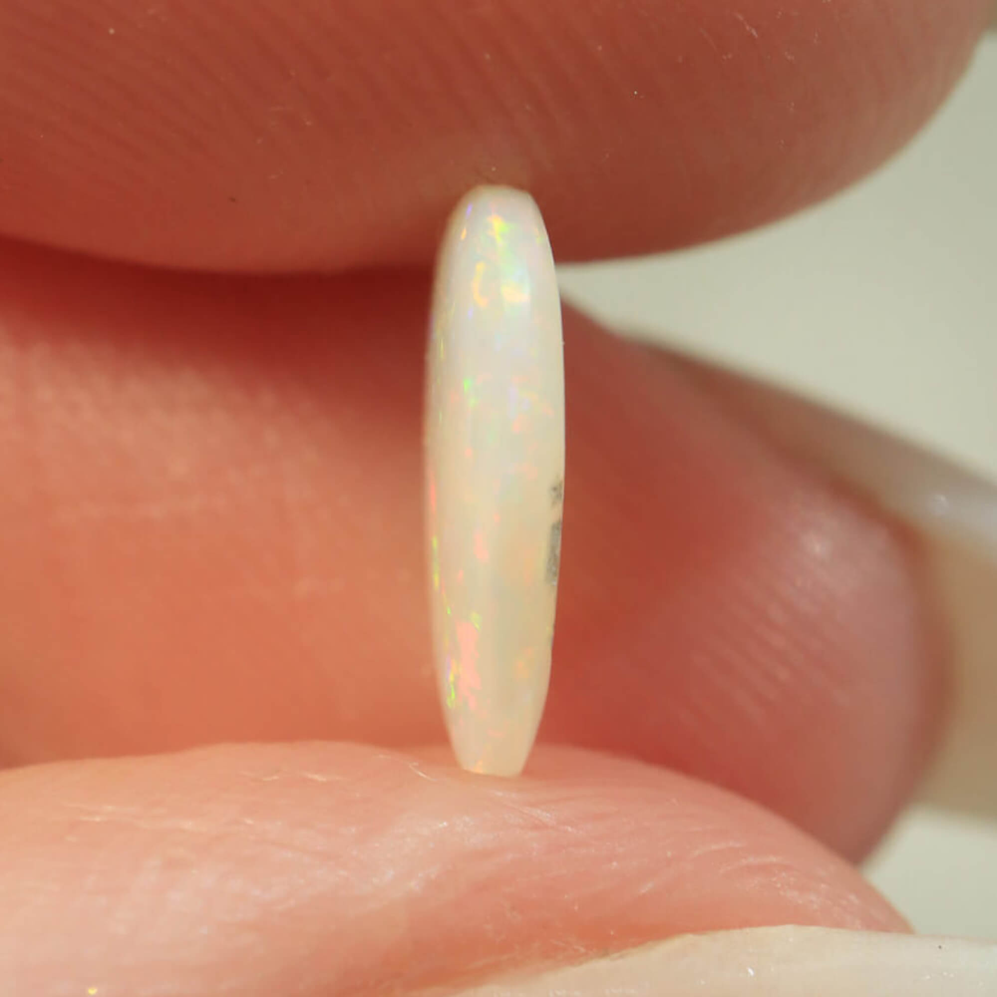 Additional view of orange-purple light opal