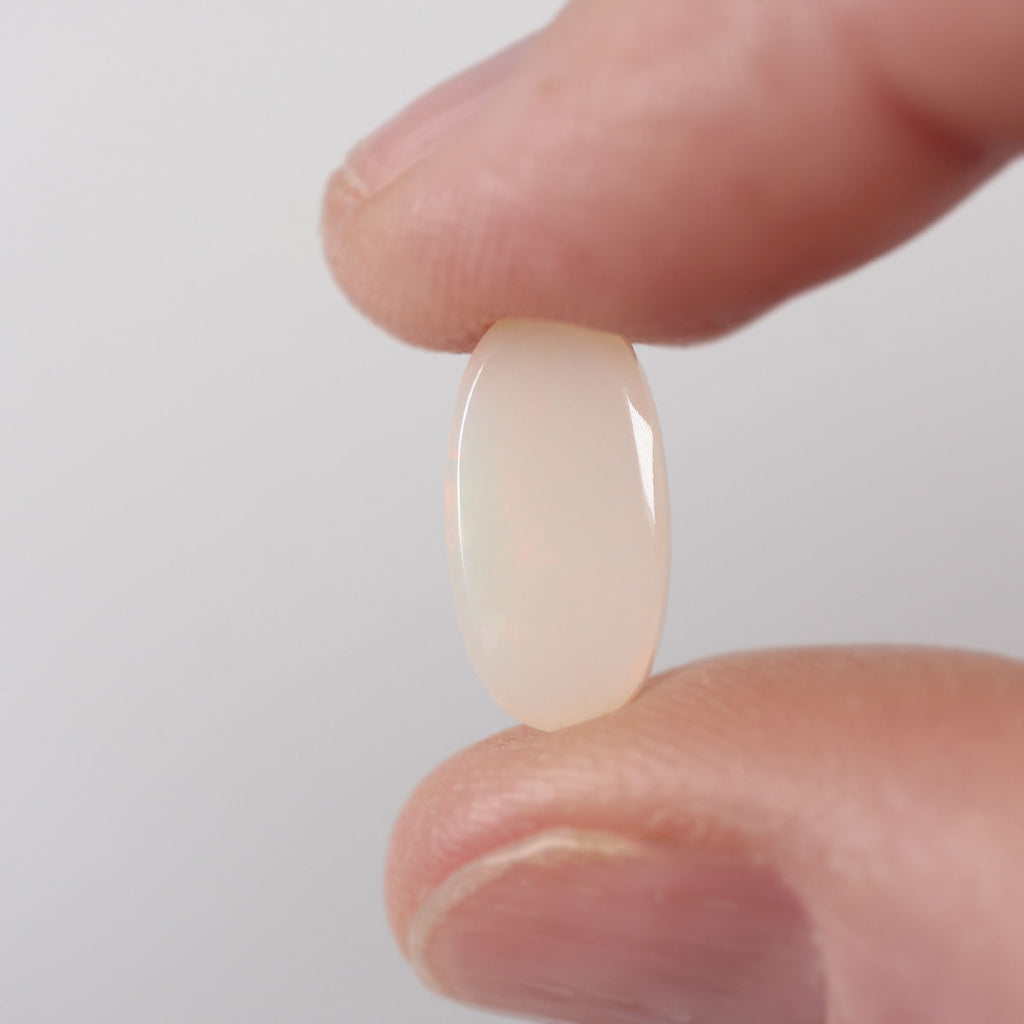 2.05ct light opal shown under rolling light