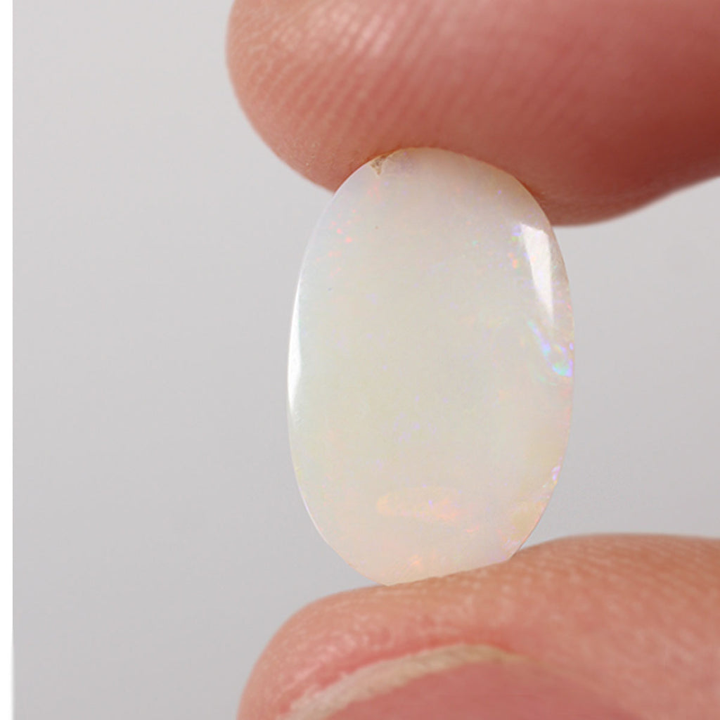 2.85ct light opal shown under rolling light