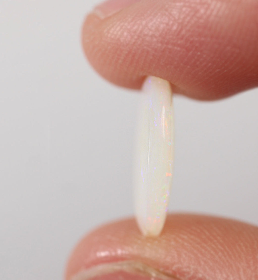 Additional view of green-orange light opal