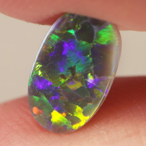 Natural black opal from Lightning Ridge, 0.65ct with bright green-yellow flash