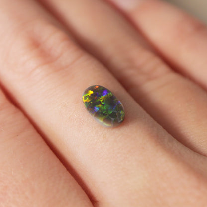 0.65ct Black Opal - 5.5 x 9.5 x 1.7mm