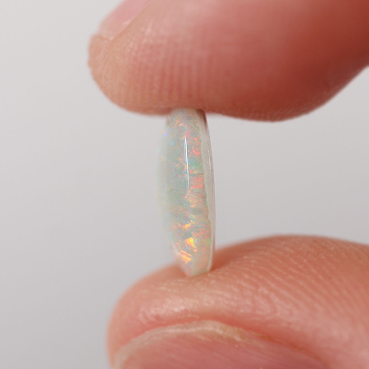 Extra view of Australian dark opal with green-orange flash