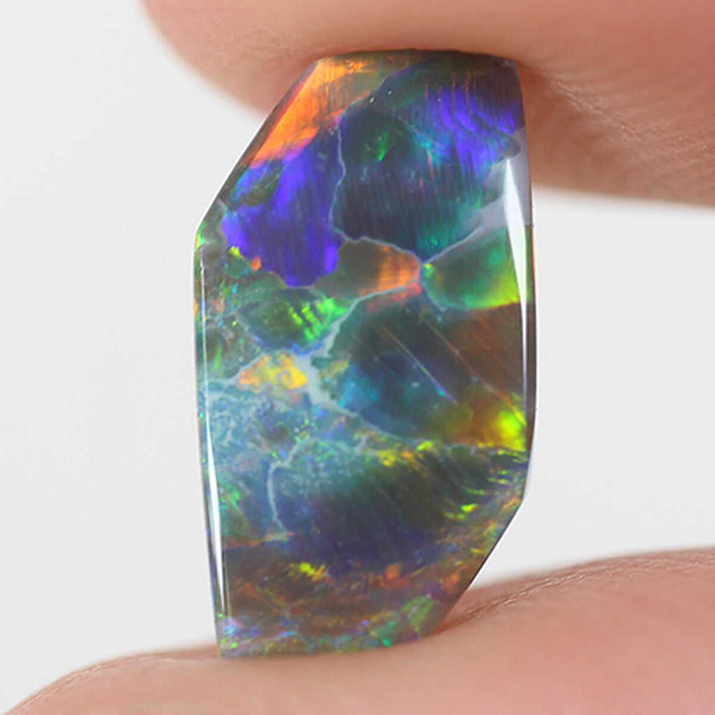 1.26ct Black Opal - 5.5 x 9.5 x 3mm