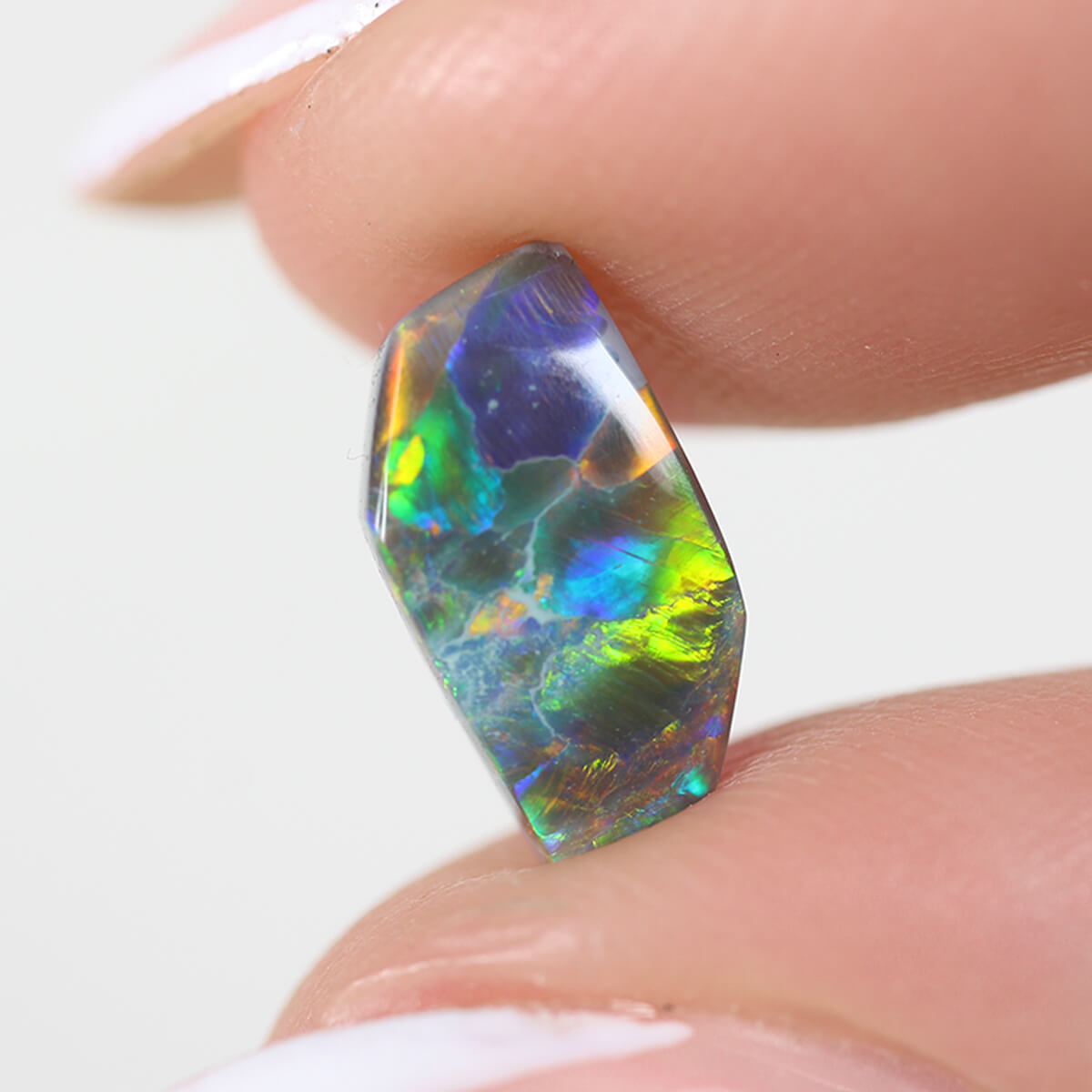 1.26ct Black Opal - 5.5 x 9.5 x 3mm