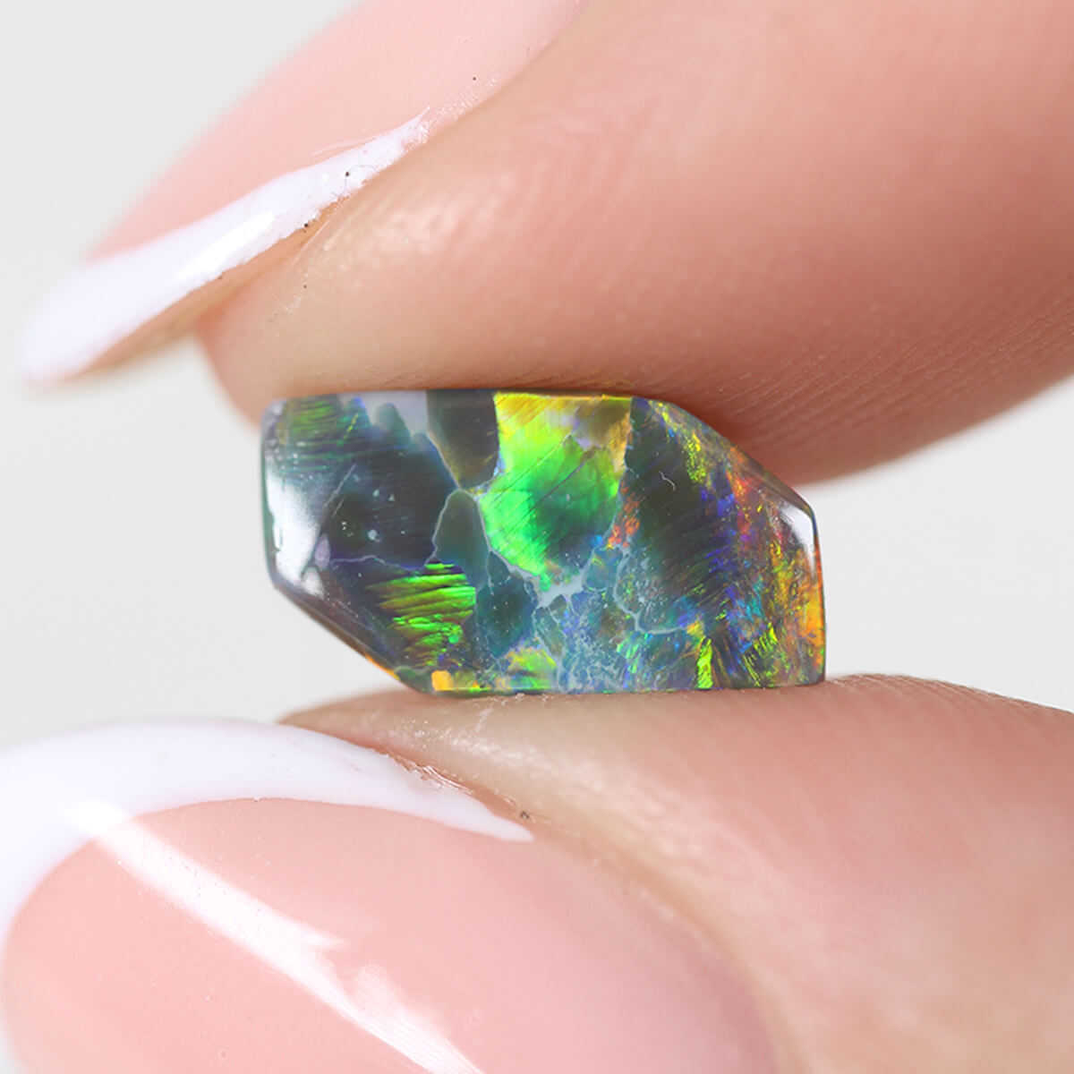 1.26ct Black Opal - 5.5 x 9.5 x 3mm