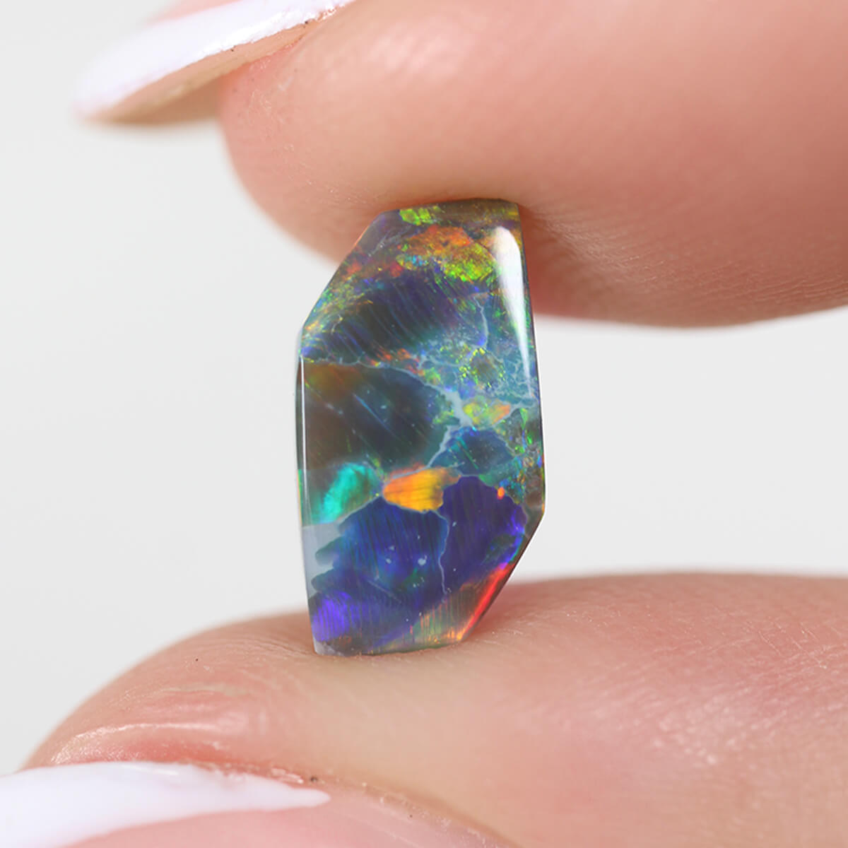 1.26ct Black Opal - 5.5 x 9.5 x 3mm