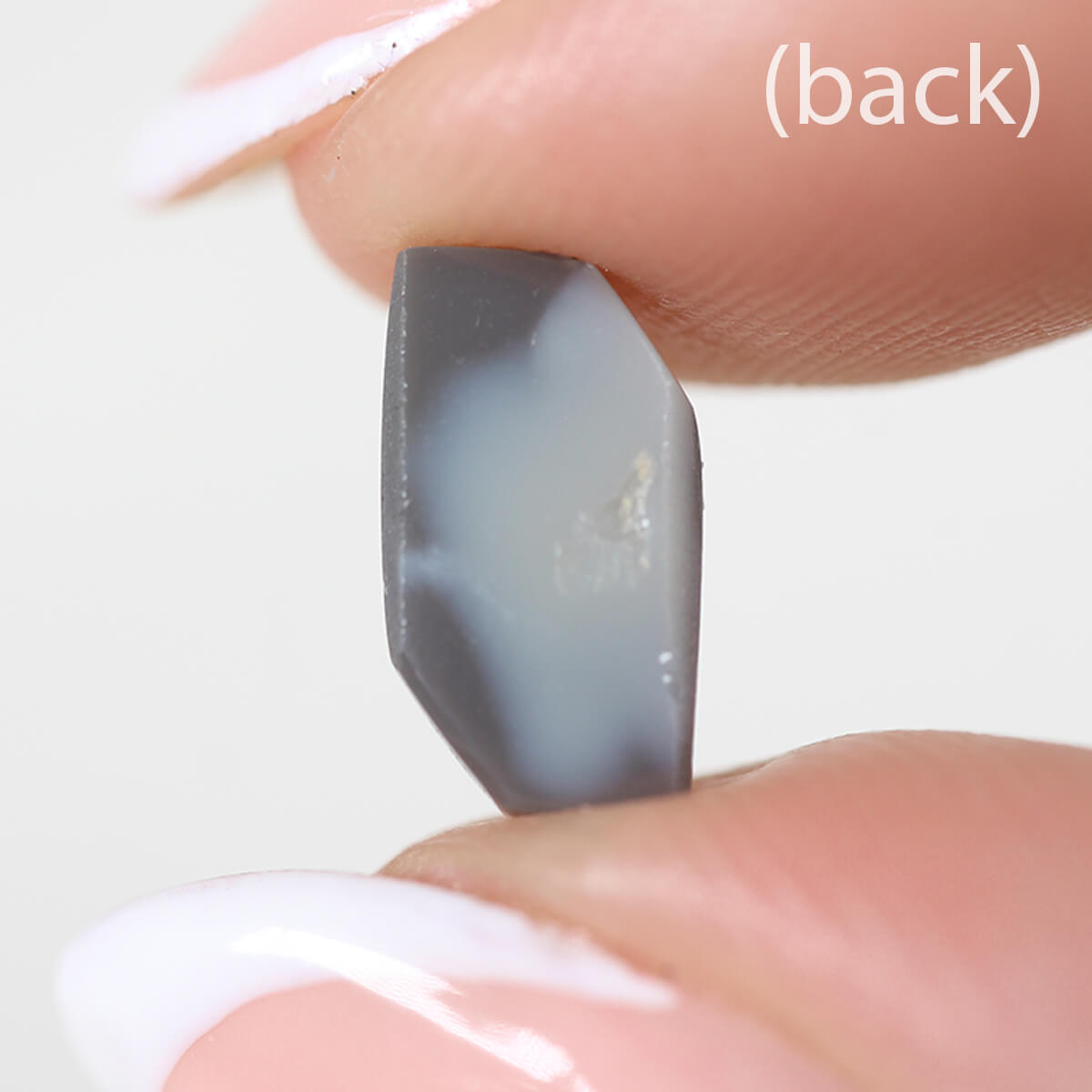 1.26ct Black Opal - 5.5 x 9.5 x 3mm