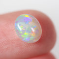 Side profile of 0.87ct crystal opal showing natural solid body
