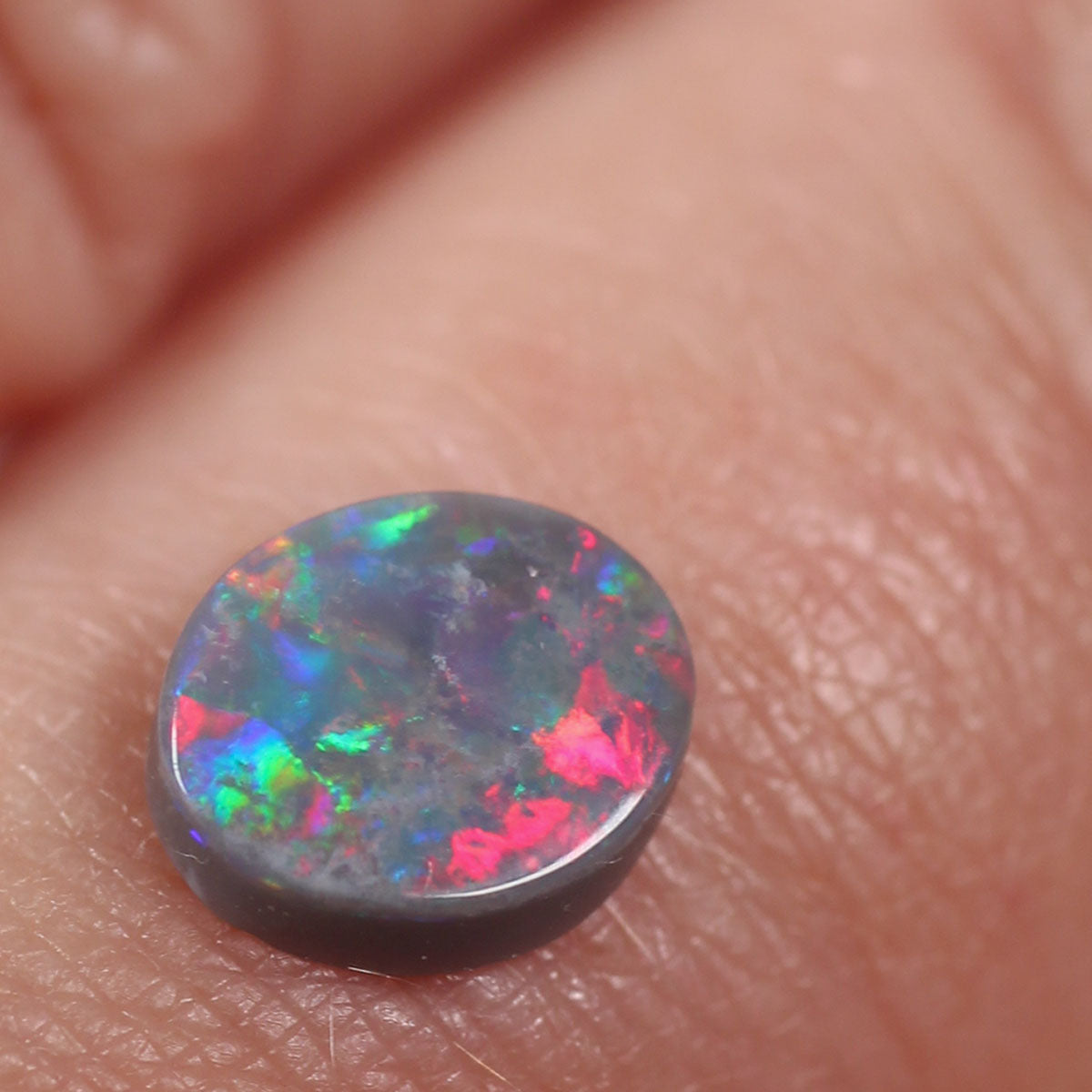 0.74ct Black Opal - 6.5 x 7.5 x 2.5mm