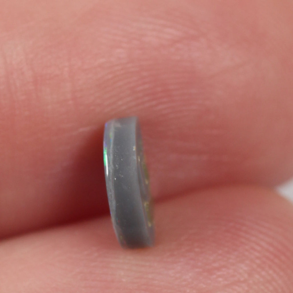 0.74ct Black Opal - 6.5 x 7.5 x 2.5mm