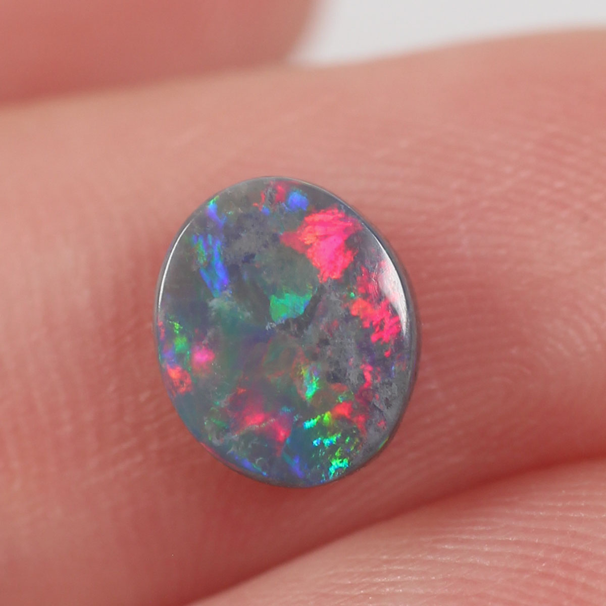 0.74ct Black Opal - 6.5 x 7.5 x 2.5mm