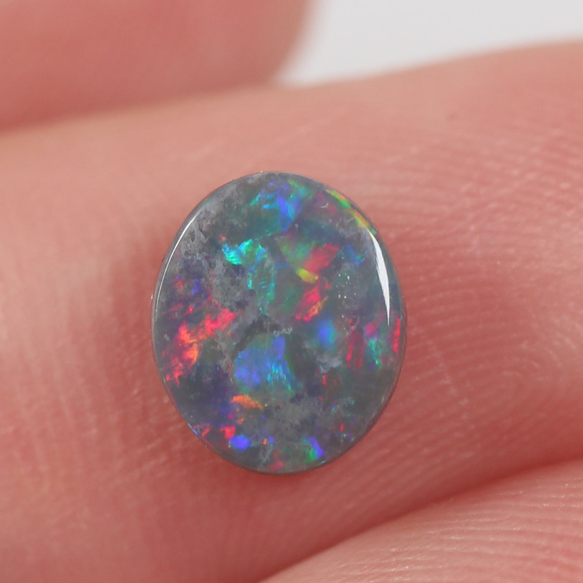 0.74ct Black Opal - 6.5 x 7.5 x 2.5mm