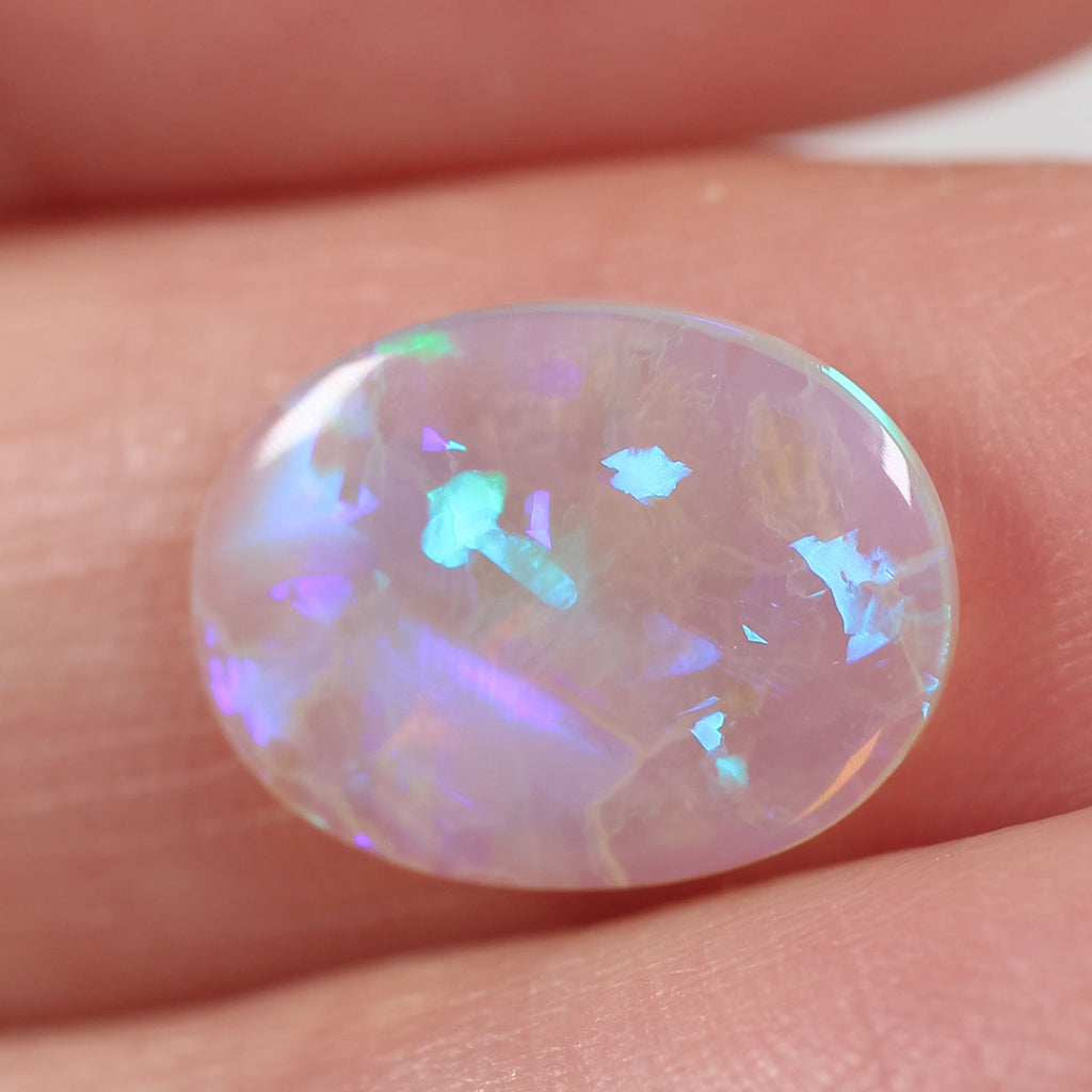 Natural light crystal opal from Lightning Ridge, 1.86ct with soft orange flash