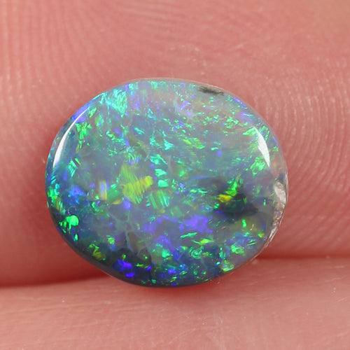 Side profile of 1.07ct dark opal showing natural solid body