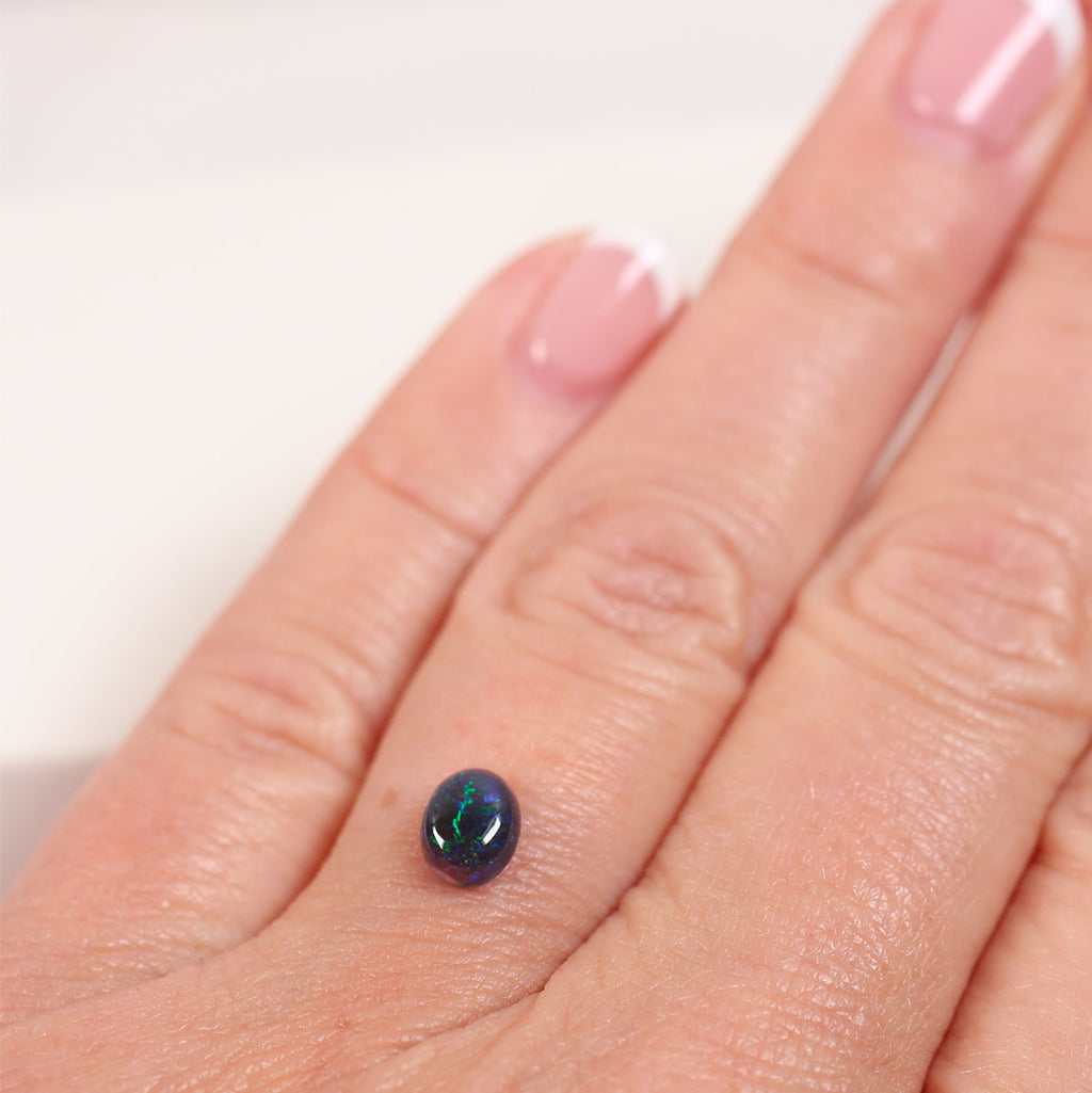 0.6ct Black Opal - 5.2 x 6.6 x 3mm