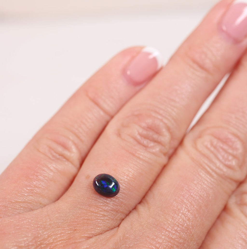 0.6ct Black Opal - 5.2 x 6.6 x 3mm