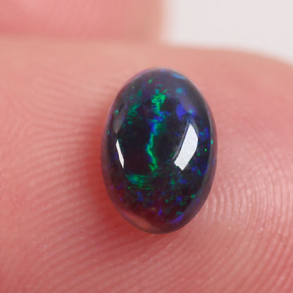 0.6 ct Black Opal - 5.2 x 6.6 x 3mm