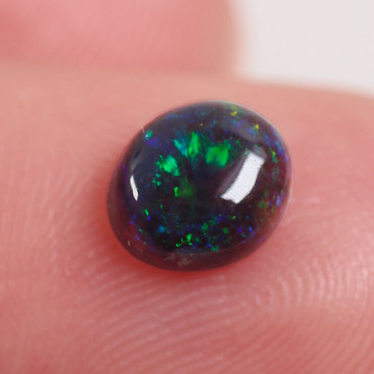 0.6 ct Black Opal - 5.2 x 6.6 x 3mm