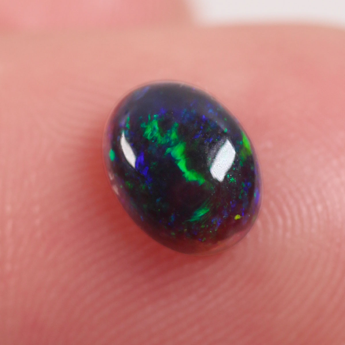 0.6ct Black Opal - 5.2 x 6.6 x 3mm