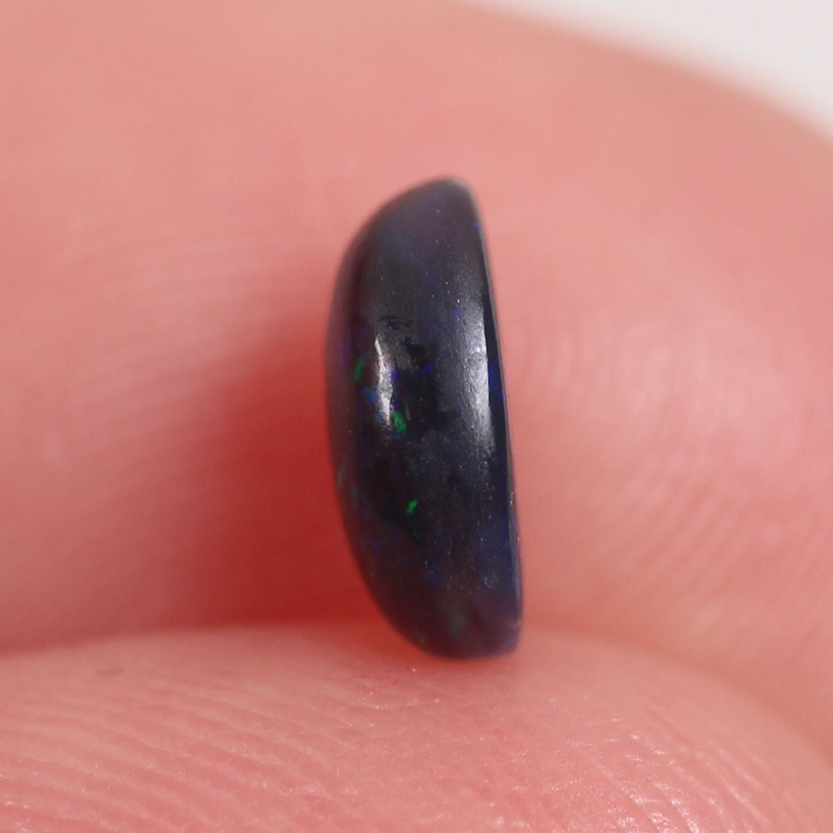0.6ct Black Opal - 5.2 x 6.6 x 3mm