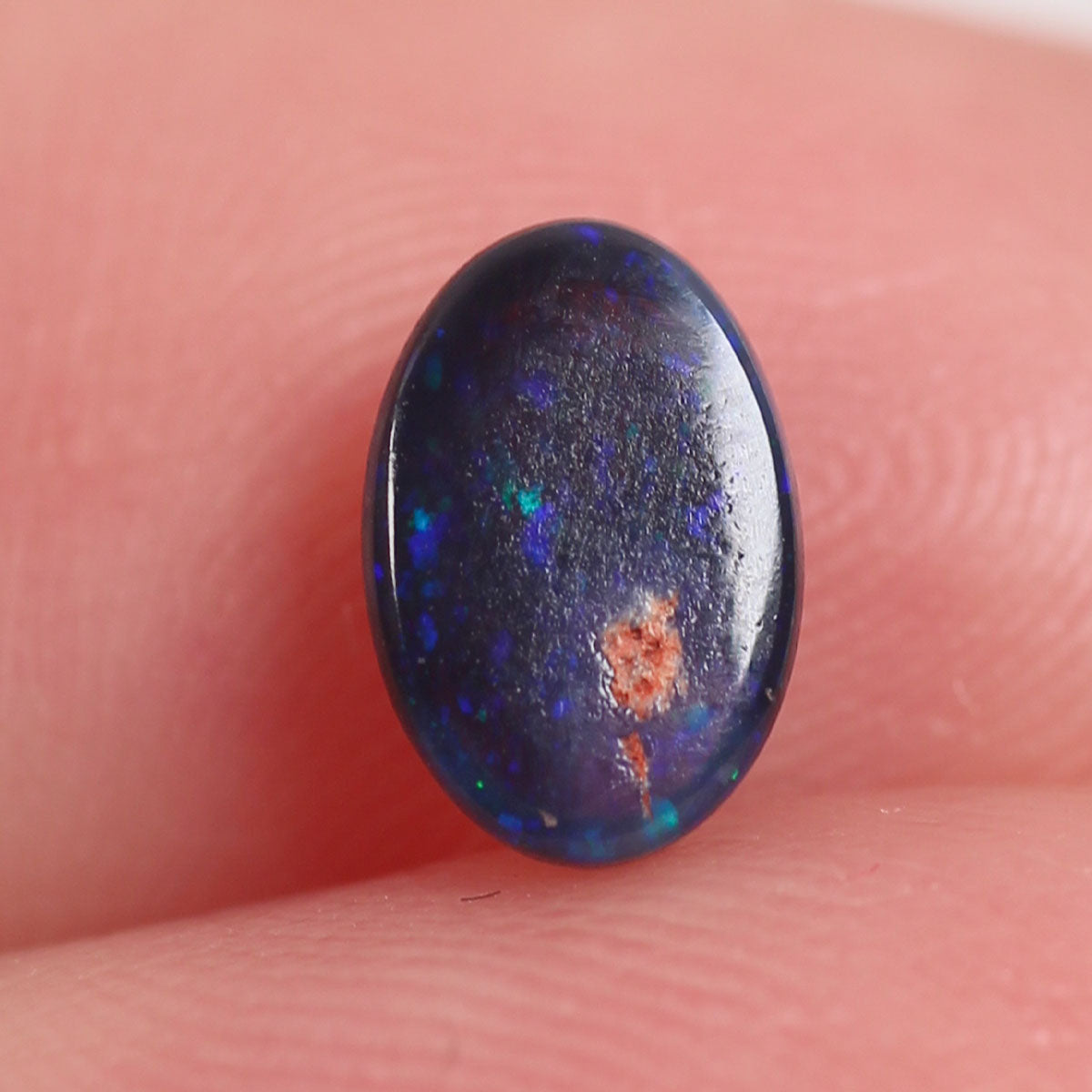 0.6 ct Black Opal - 5.2 x 6.6 x 3mm