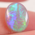 Crystal opal under direct light showing lively rolling flash