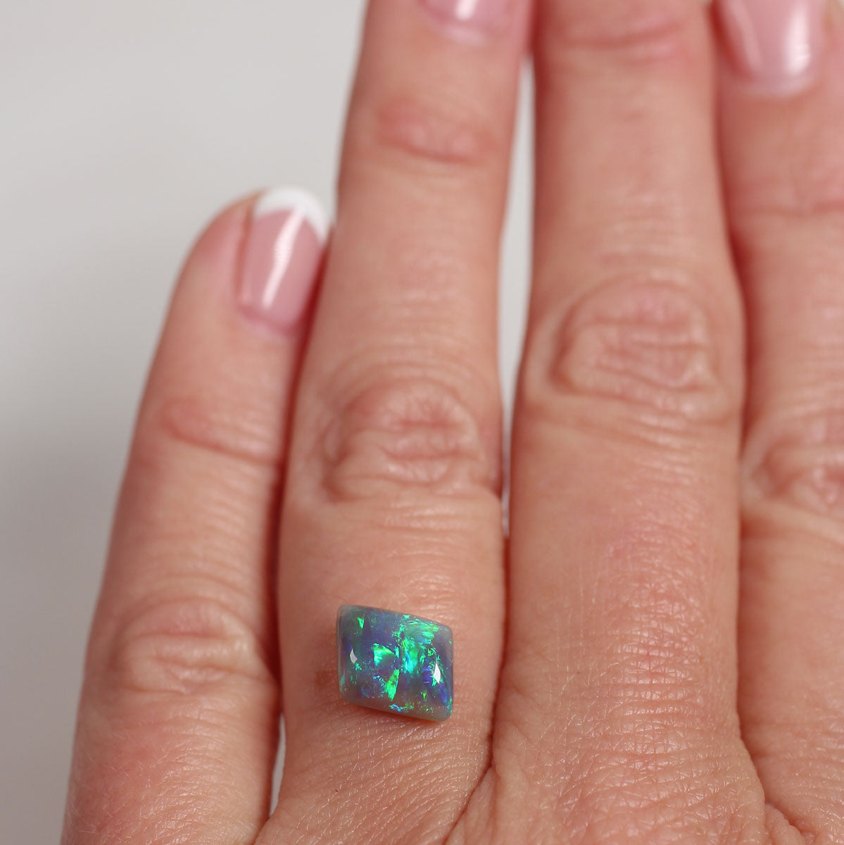 1.8ct Dark Opal - 6.6 x 8.7 x 4mm