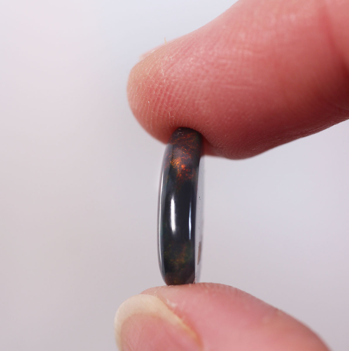 4.7ct Black Opal - 11.2 x 15.7 x 4mm