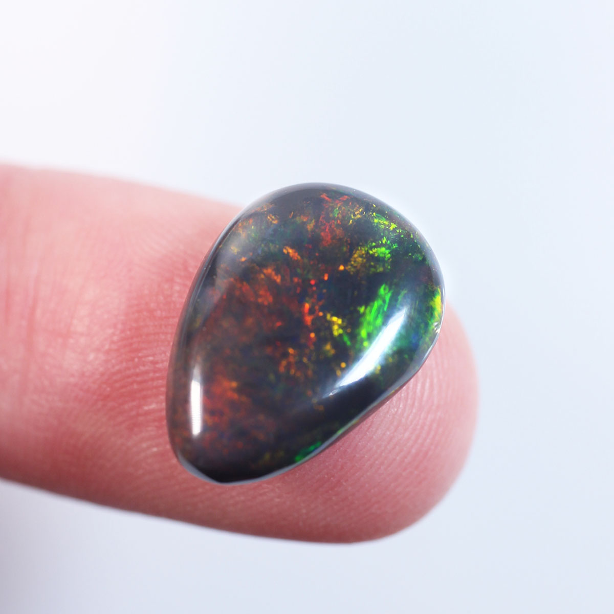 4.7ct Black Opal - 11.2 x 15.7 x 4mm