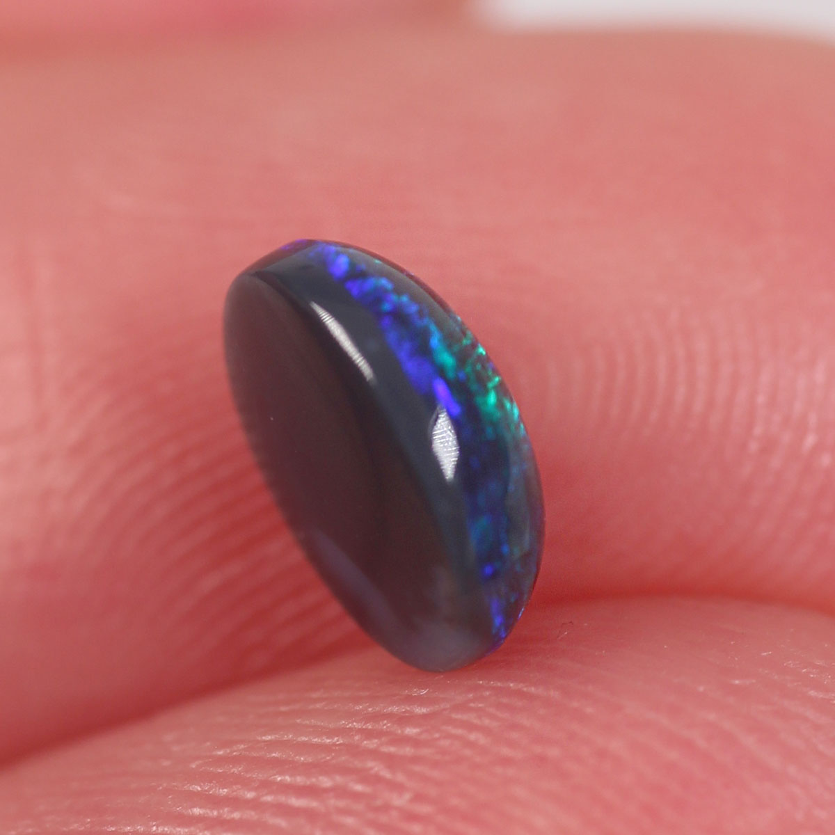 0.84ct Black Opal - 6 x 7.2 x 3mm