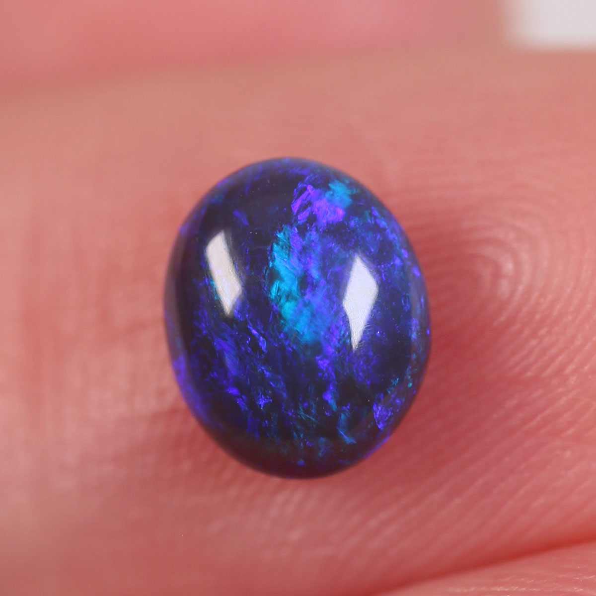 0.84 ct Black Opal - 6 x 7.2 x 3mm