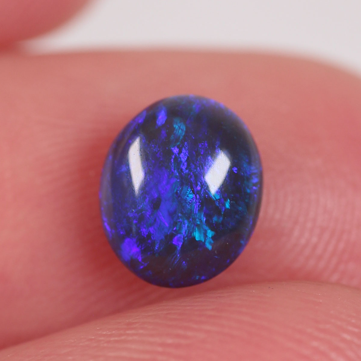 0.84 ct Black Opal - 6 x 7.2 x 3mm