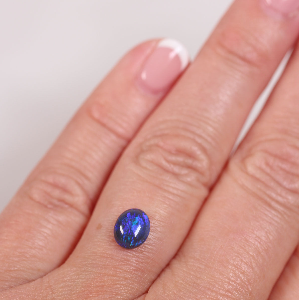 0.84 ct Black Opal - 6 x 7.2 x 3mm