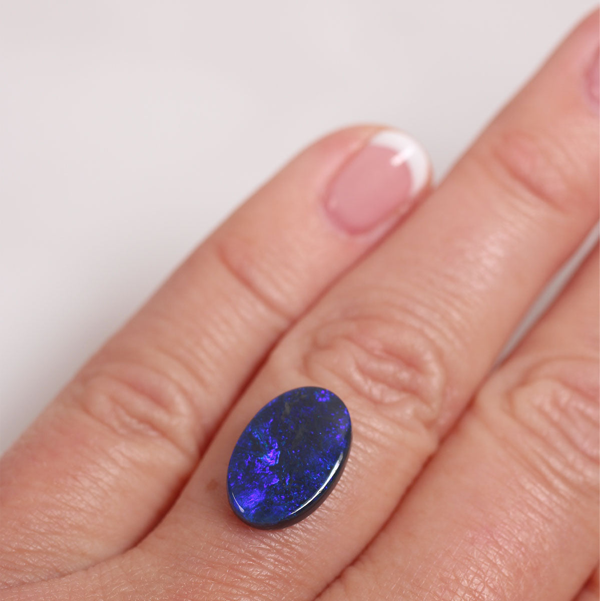2.7ct Black Opal - 9.4 x 14 x 2.9mm