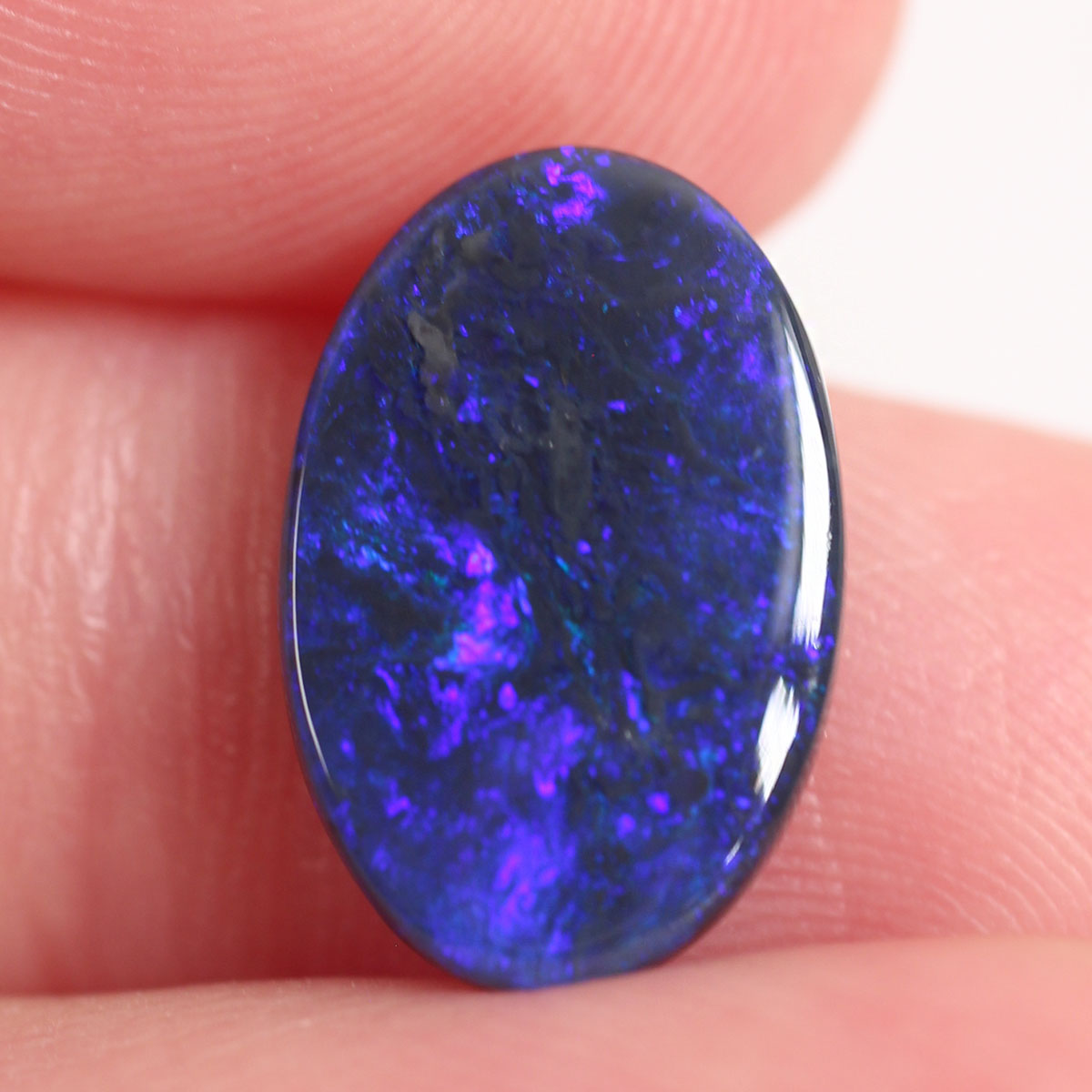2.7ct Black Opal - 9.4 x 14 x 2.9mm