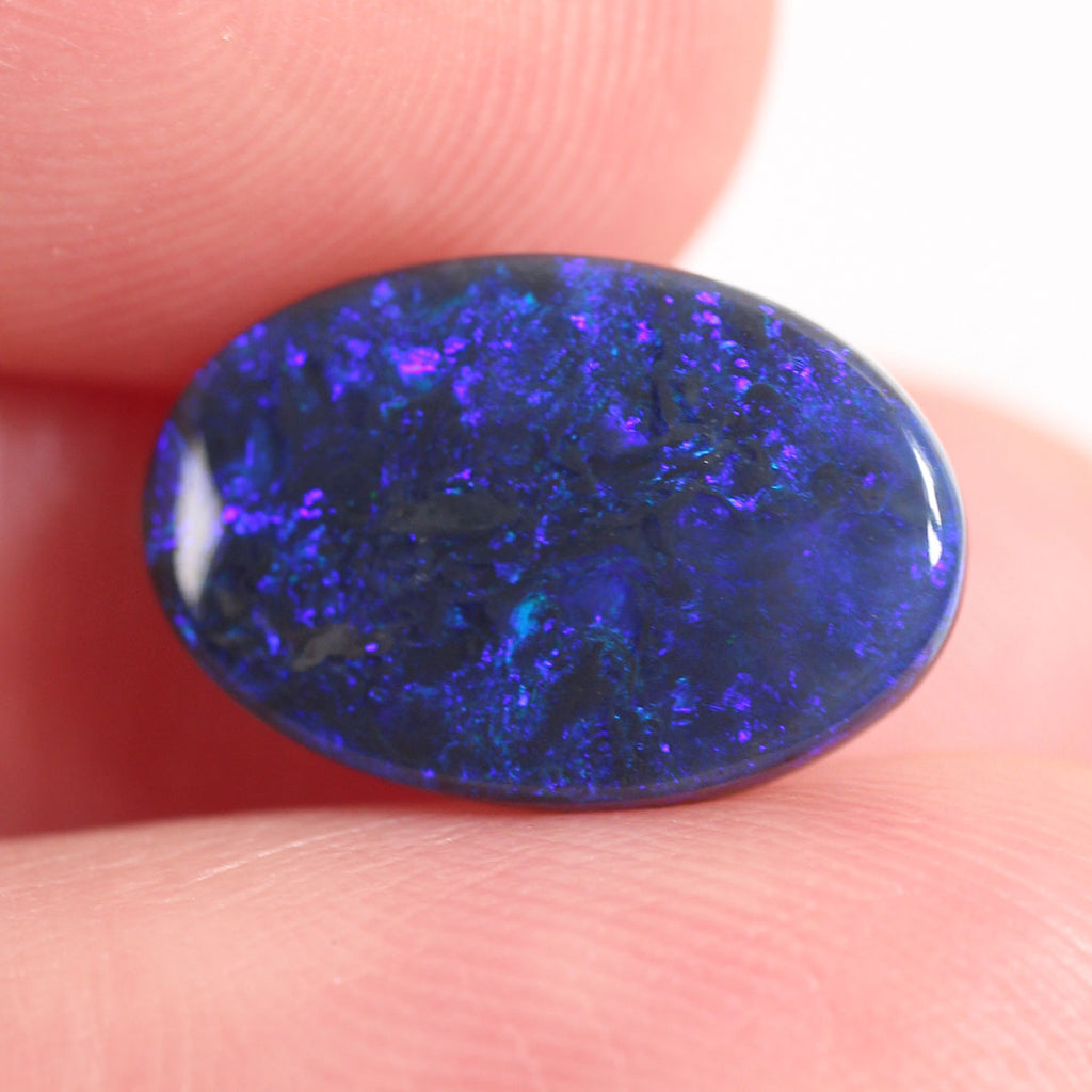 2.7ct Black Opal - 9.4 x 14 x 2.9mm