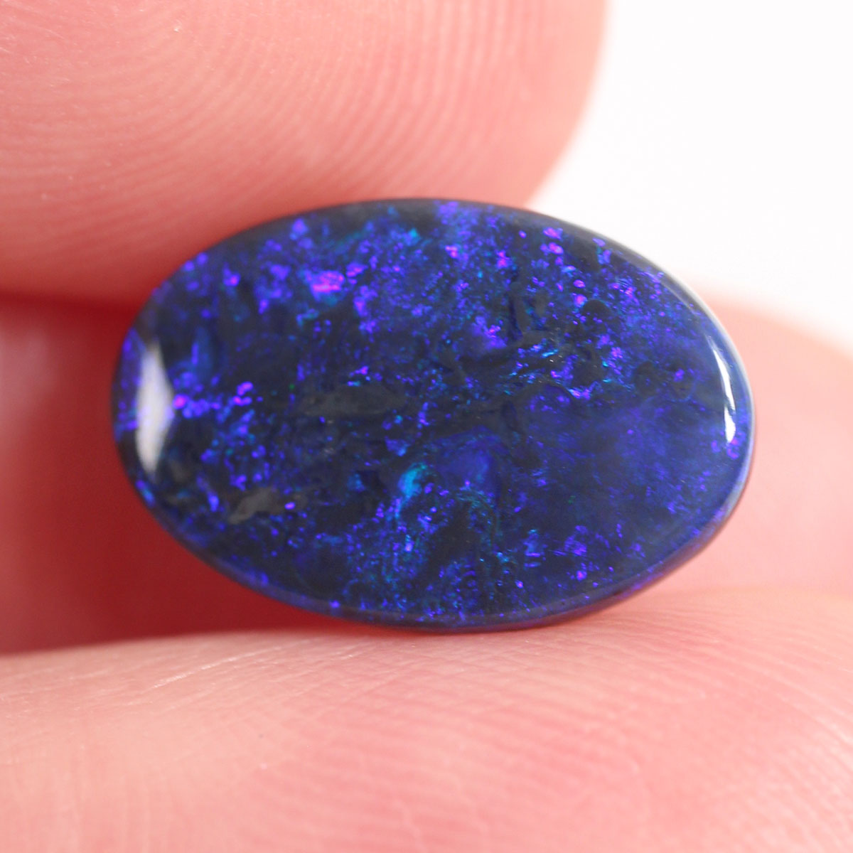 2.7ct Black Opal - 9.4 x 14 x 2.9mm