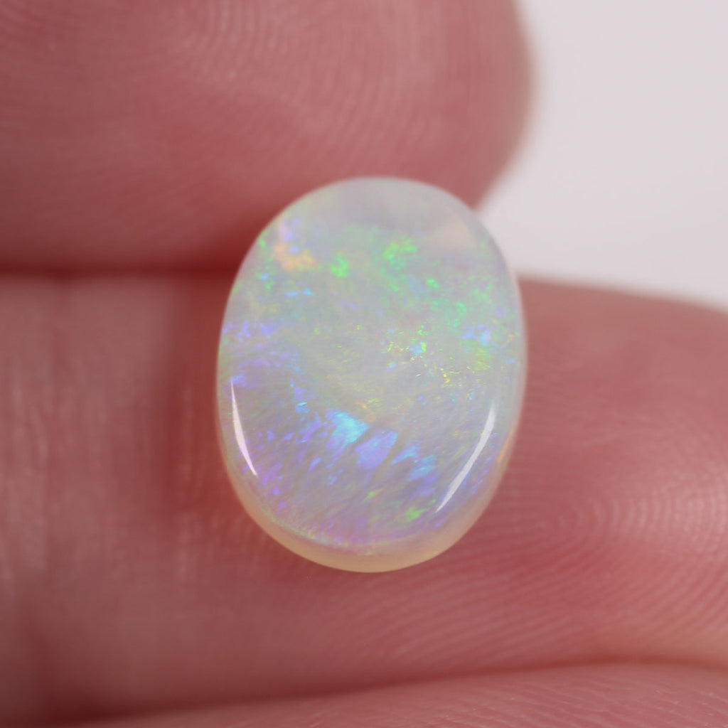 Macro detail of light opal cabochon